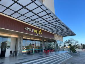 a building with a sign on the side of it at Rakabi The Fern, Igatpuri in Igatpuri