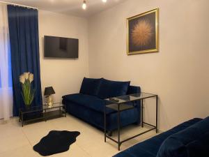 Televízia a/alebo spoločenská miestnosť v ubytovaní Diament Apartment + 3 fotografie