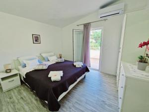 Postel nebo postele na pokoji v ubytování Guest House Antonia