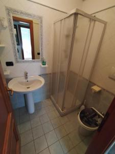 a bathroom with a shower and a sink at Mattoni Nel Verde in Casal Palocco