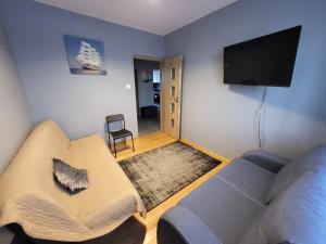 TV i/ili multimedijalni sistem u objektu Apartament Julia Łeba