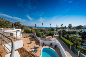 a villa with a swimming pool and a resort at Beach Park Apartments in Luz