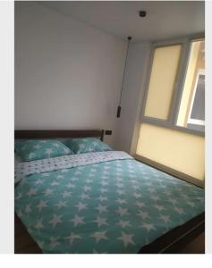 Postel nebo postele na pokoji v ubytování Затишна квартира біля автовокзалу та неподалік центру