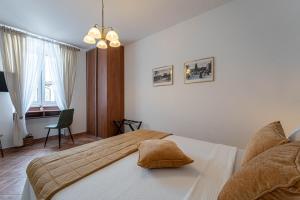 a bedroom with a bed and a chair at Ferienhaus/HolidayHouse Smokvica **** in Rakalj in Rakalj +21 photos