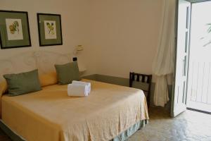 Postel nebo postele na pokoji v ubytování La Salina Hotel Borgo Di Mare