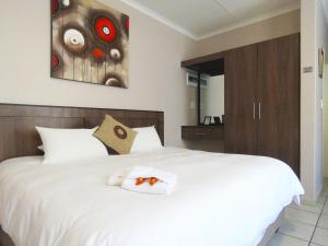 Andante Guesthouse Klerksdorp客房内的一张或多张床位
