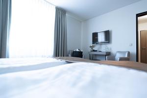 Ein Bett oder Betten in einem Zimmer der Unterkunft Bernstein Salzlandcenter