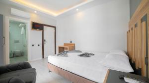 Postel nebo postele na pokoji v ubytování Kafkas Hotel
