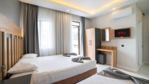 Postel nebo postele na pokoji v ubytování Kafkas Hotel