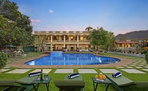 a resort with a swimming pool and a building at Vatsalya Vihar - A Luxury Pool Villas Resort in Udaipur
