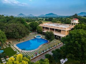 an aerial view of a house with a swimming pool at Vatsalya Vihar - A Luxury Pool Villas Resort in Udaipur +74 photos