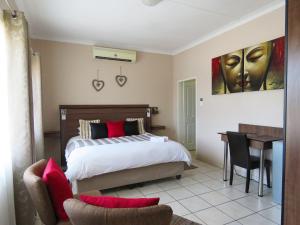Andante Guesthouse Klerksdorp客房内的一张或多张床位