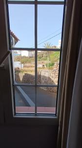 a window in a room with a view of a street at Hotel Boomerang in Valverde