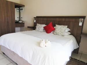 Andante Guesthouse Klerksdorp客房内的一张或多张床位