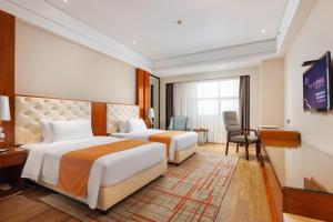 Letto o letti in una camera di Zhongshan Phoenix By Funyard