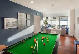 a living room with a pool table in a room at 5 Rockham - Luxury Apartment at Byron Woolacombe, only 4 minute walk to Woolacombe Beach! in Woolacombe