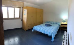 Ένα ή περισσότερα κρεβάτια σε δωμάτιο στο Casa Linda