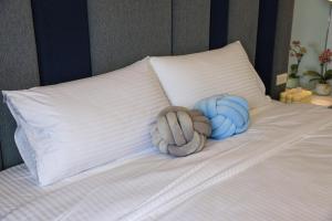 Postel nebo postele na pokoji v ubytování 鴝花甜點民宿 QuHua Sweety B&B