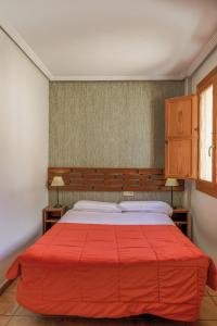 Łóżko lub łóżka w pokoju w obiekcie Barranco de la Olla by Apartamentos Arnedillo