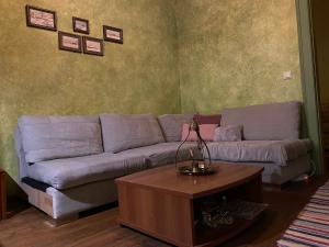 a living room with a couch and a coffee table at MOLYVOS BOUTIQUE HOUSE in Mythimna +41 photos