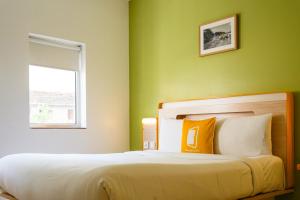 Bloom Hotel - Calangute客房内的一张或多张床位