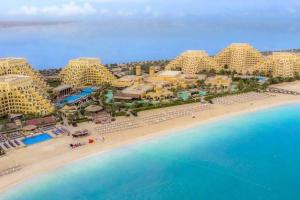 an aerial view of a resort on the beach at Luxurious Private Beach & Pool, fully Furnished 1BR Apartment at Marjan Island Ras al khaimah in Ras al Khaimah
