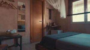 Cama o camas de una habitación en Hostal Esfigueral