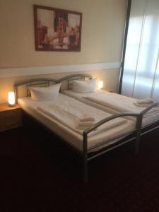 Voodi või voodid majutusasutuse WH Monteurhotel Papenburg Nord toas