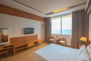 Postel nebo postele na pokoji v ubytování Sammy Hotel