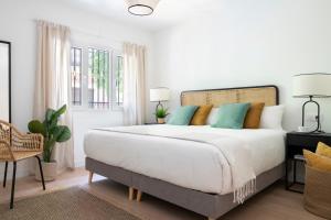 Posteľ alebo postele v izbe v ubytovaní Magno Apartments Castelar