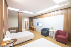 Postel nebo postele na pokoji v ubytování Sammy Hotel