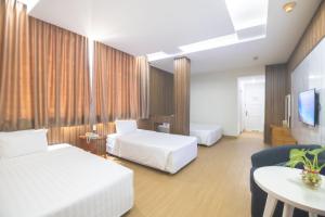 Postel nebo postele na pokoji v ubytování Sammy Hotel