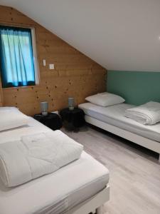 Posteľ alebo postele v izbe v ubytovaní La Ferme du Badon