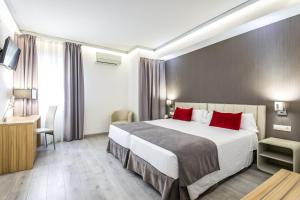 Postel nebo postele na pokoji v ubytování Sweet Hotel Renasa