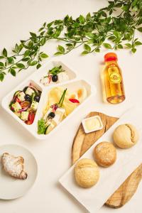 two white trays of food on a white table at Na Fursie Apartments & Rooms in Nowy Targ