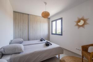 Postel nebo postele na pokoji v ubytování Bella Luce - Appt vue panoramique mer