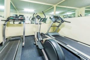 a gym with two treadmills and a treadmill at Days Inn by Wyndham Valdosta/Near Valdosta Mall in Valdosta