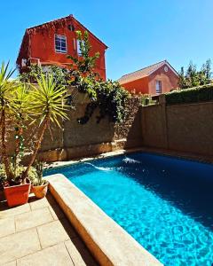 a swimming pool in front of a house at Casa Fuerteventura in Santiago
