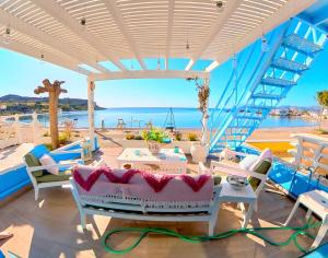 a patio with a view of the ocean at Beach Studio - Sleeps 2 & Private Ocean Terrace in Haraki