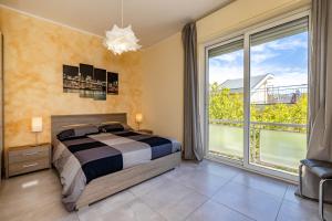 Posteľ alebo postele v izbe v ubytovaní CASA MATILDE - Appartamento Vista Mare - con posto auto