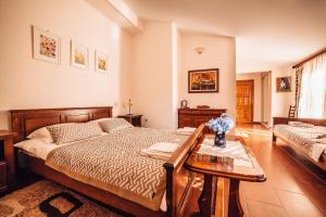 a bedroom with a bed and a table at Guest house Šebelj in Budva