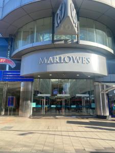 a large building with a sign on the front of it at Hemel Apartments - Hemel Haven in Hemel Hempstead