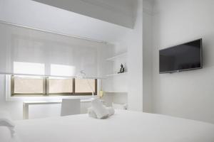 Posteľ alebo postele v izbe v ubytovaní Apartamento reformado junto a la playa de la Concha en Donostia-San Sebastián - Marina 4
