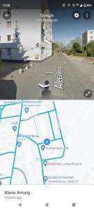 a screenshot of a street with a map and a screenshot of a building at Apartament Amurg in Dej