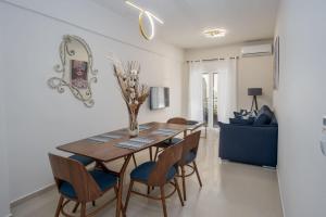 a dining room with a table and chairs at Downtown Guesthouse by Estia in Heraklio Town