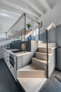 a staircase in a house with a kitchen and a stove at Deep Lock Studio in Bath