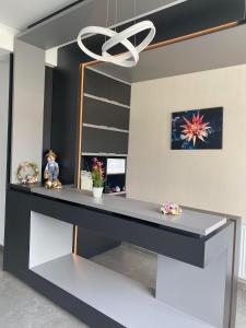 a desk in a room with a mirror at Pensiunea Mountain Pearl in Deseşti