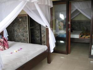 Krevet ili kreveti u jedinici u objektu Bukit Indah Homestay