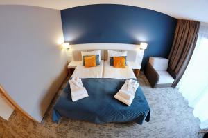 Postel nebo postele na pokoji v ubytování Hotel Hel