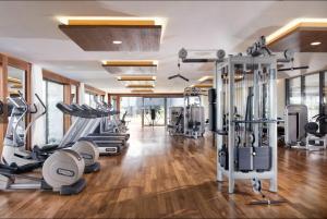 a gym with treadmills and elliptical machines at Sea Canal Townhouse in Göcek